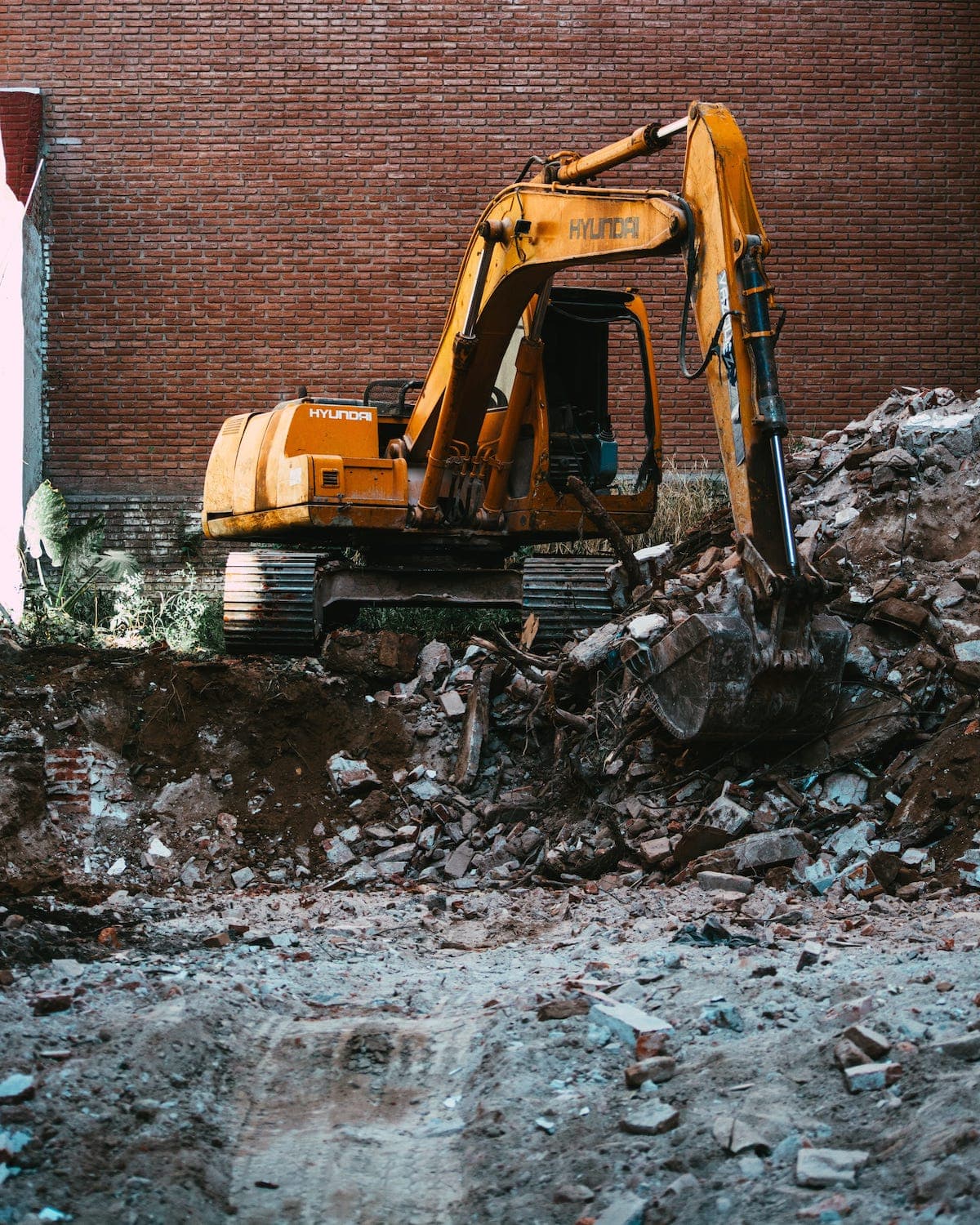 A bulldozer near a wall